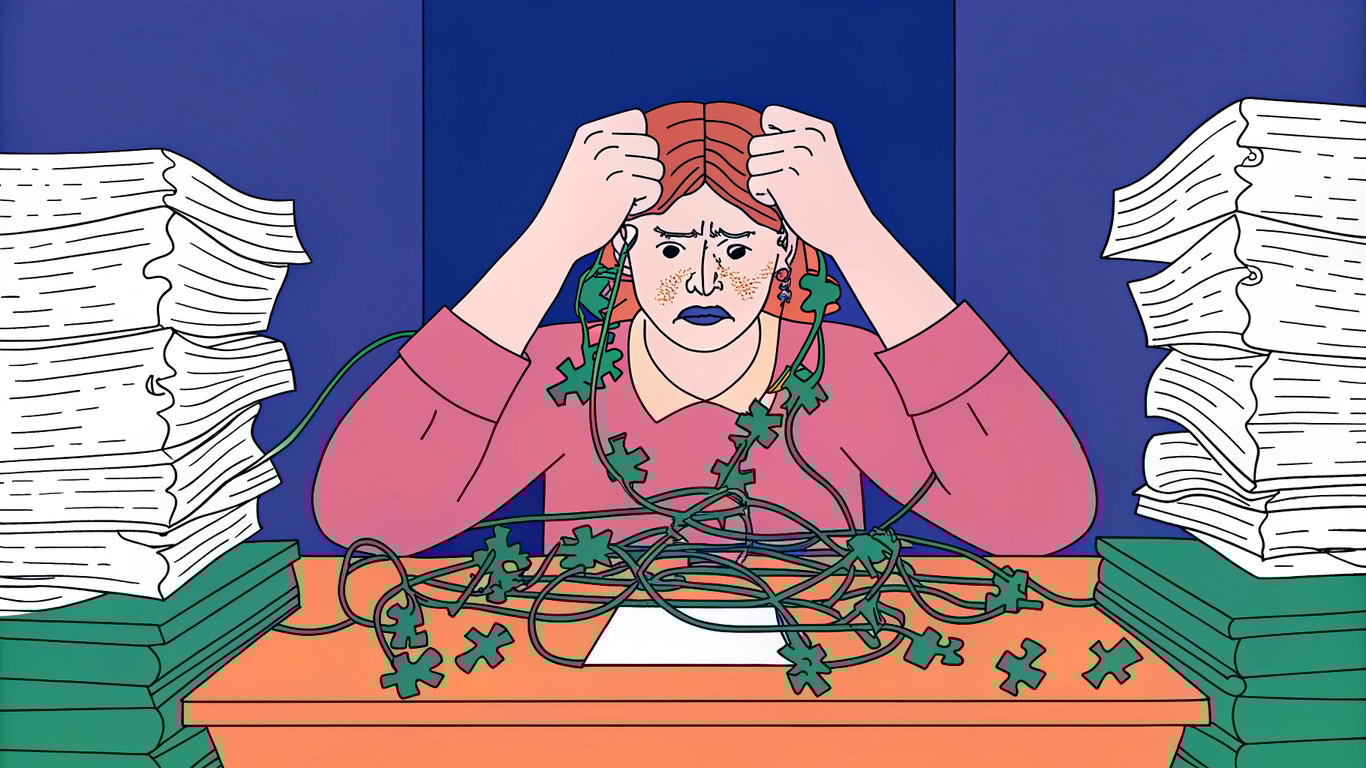 A person looking overwhelmed by the complexity of manual SEO tasks, surrounded by papers and wires.